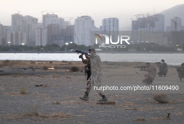 An Islamic Revolutionary Guard Corps (IRGC) military personnel takes part in a war game, which is a reconstruction of the Valfajr-8 military...