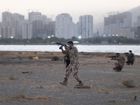 An Islamic Revolutionary Guard Corps (IRGC) military personnel takes part in a war game, which is a reconstruction of the Valfajr-8 military...