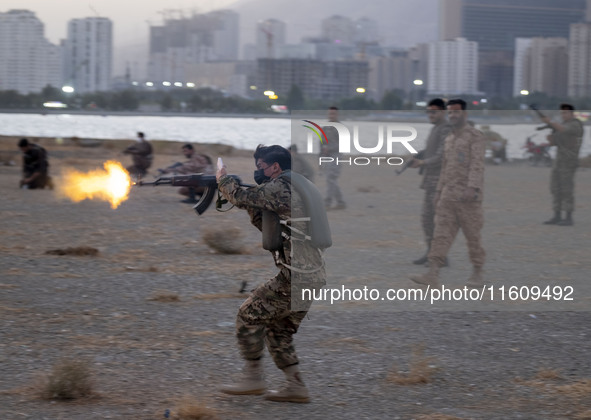 An Islamic Revolutionary Guard Corps (IRGC) military personnel takes part in a war game, which is a reconstruction of the Valfajr-8 military...