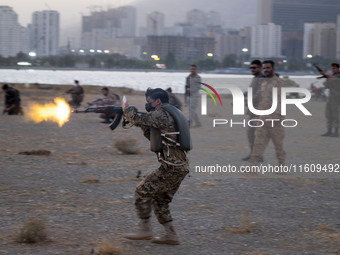 An Islamic Revolutionary Guard Corps (IRGC) military personnel takes part in a war game, which is a reconstruction of the Valfajr-8 military...