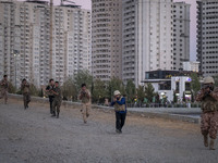 Islamic Revolutionary Guard Corps (IRGC) military personnel take part in a war game, which is a reconstruction of the Valfajr-8 military ope...