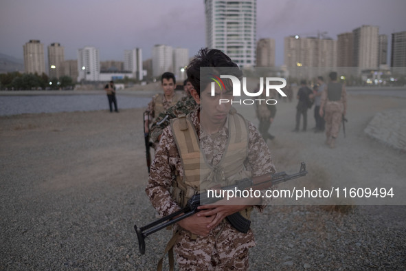 An Islamic Revolutionary Guard Corps (IRGC) military personnel takes part in a war game, which is a reconstruction of the Valfajr-8 military...