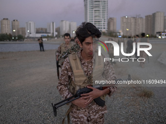 An Islamic Revolutionary Guard Corps (IRGC) military personnel takes part in a war game, which is a reconstruction of the Valfajr-8 military...