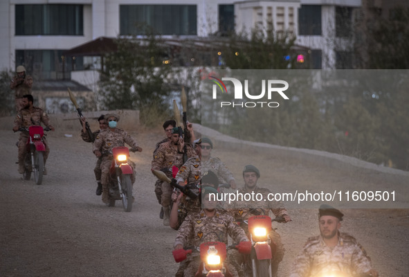 Islamic Revolutionary Guard Corps (IRGC) military personnel take part in a war game, which is a reconstruction of the Valfajr-8 military ope...