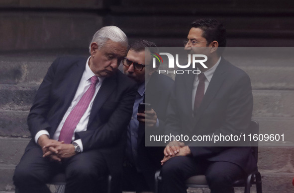 Andres Manuel Lopez Obrador, President of Mexico, receives a message from his team of aides during the inauguration ceremony of the Museo Vi...