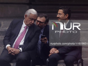 Andres Manuel Lopez Obrador, President of Mexico, receives a message from his team of aides during the inauguration ceremony of the Museo Vi...