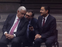 Andres Manuel Lopez Obrador, President of Mexico, receives a message from his team of aides during the inauguration ceremony of the Museo Vi...