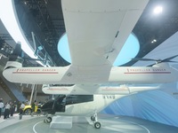 Visitors view the AE200 tilt-rotor electric vertical Take-off and Landing aircraft (eVTOL) at the Global Digital Trade Expo in Hangzhou, Chi...