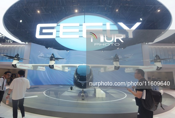 Visitors view the AE200 tilt-rotor electric vertical Take-off and Landing aircraft (eVTOL) at the Global Digital Trade Expo in Hangzhou, Chi...