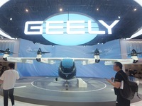 Visitors view the AE200 tilt-rotor electric vertical Take-off and Landing aircraft (eVTOL) at the Global Digital Trade Expo in Hangzhou, Chi...