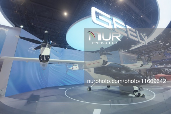 Visitors view the AE200 tilt-rotor electric vertical Take-off and Landing aircraft (eVTOL) at the Global Digital Trade Expo in Hangzhou, Chi...