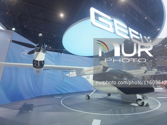 Visitors view the AE200 tilt-rotor electric vertical Take-off and Landing aircraft (eVTOL) at the Global Digital Trade Expo in Hangzhou, Chi...