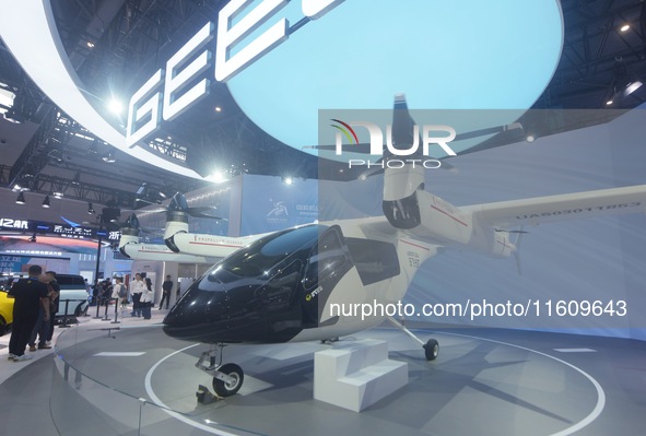 Visitors view the AE200 tilt-rotor electric vertical Take-off and Landing aircraft (eVTOL) at the Global Digital Trade Expo in Hangzhou, Chi...