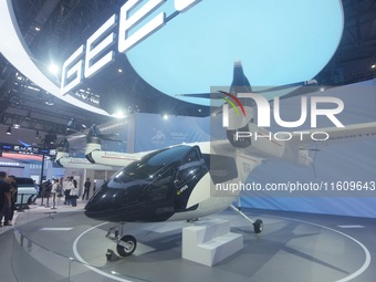 Visitors view the AE200 tilt-rotor electric vertical Take-off and Landing aircraft (eVTOL) at the Global Digital Trade Expo in Hangzhou, Chi...