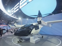 Visitors view the AE200 tilt-rotor electric vertical Take-off and Landing aircraft (eVTOL) at the Global Digital Trade Expo in Hangzhou, Chi...