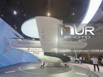 Visitors view the AE200 tilt-rotor electric vertical Take-off and Landing aircraft (eVTOL) at the Global Digital Trade Expo in Hangzhou, Chi...