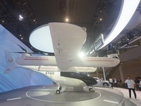 Visitors view the AE200 tilt-rotor electric vertical Take-off and Landing aircraft (eVTOL) at the Global Digital Trade Expo in Hangzhou, Chi...