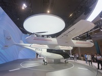 Visitors view the AE200 tilt-rotor electric vertical Take-off and Landing aircraft (eVTOL) at the Global Digital Trade Expo in Hangzhou, Chi...