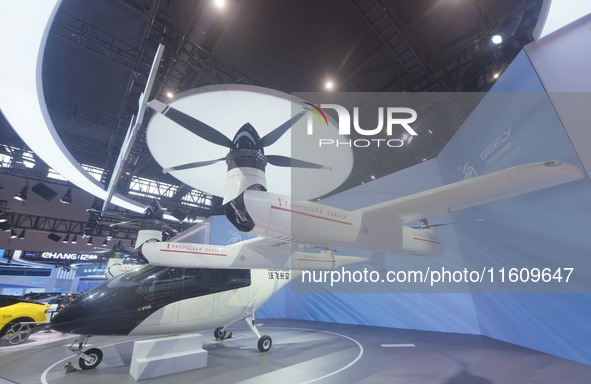 Visitors view the AE200 tilt-rotor electric vertical Take-off and Landing aircraft (eVTOL) at the Global Digital Trade Expo in Hangzhou, Chi...