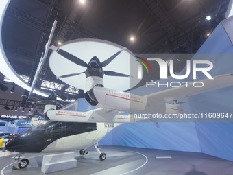 Visitors view the AE200 tilt-rotor electric vertical Take-off and Landing aircraft (eVTOL) at the Global Digital Trade Expo in Hangzhou, Chi...