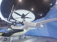 Visitors view the AE200 tilt-rotor electric vertical Take-off and Landing aircraft (eVTOL) at the Global Digital Trade Expo in Hangzhou, Chi...