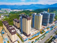 Builders step up construction at the construction site of the Zaofan resettlement area in Yuexi County, Anqing, China, on September 25, 2024...