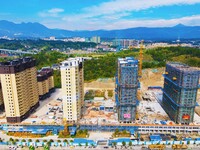 Builders step up construction at the construction site of the Zaofan resettlement area in Yuexi County, Anqing, China, on September 25, 2024...