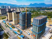 Builders step up construction at the construction site of the Zaofan resettlement area in Yuexi County, Anqing, China, on September 25, 2024...