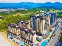 Builders step up construction at the construction site of the Zaofan resettlement area in Yuexi County, Anqing, China, on September 25, 2024...