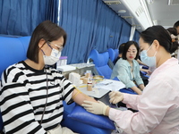 Primary school teachers donate blood on a mobile blood collection vehicle in Yancheng, China, on September 26, 2024. (