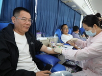 Primary school teachers donate blood on a mobile blood collection vehicle in Yancheng, China, on September 26, 2024. (