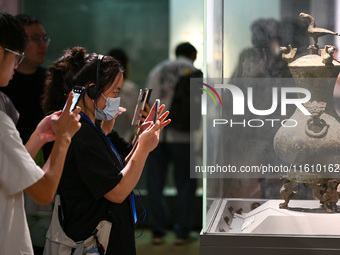 Visitors visit the Nanjing Museum in Nanjing, China, on September 26, 2024. By the end of August 2024, the 6,833 museums officially register...