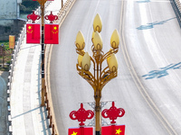 National flags are displayed on the Qiyan Bridge to celebrate China's National Day in Tongren, China, on September 26, 2024. (