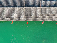 National flags are displayed on the Qiyan Bridge to celebrate China's National Day in Tongren, China, on September 26, 2024. (