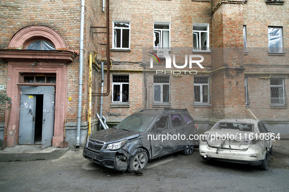 Cars damaged by falling wreckage of a downed Russian 'Shahed' drone in the Pechersk district of Kyiv, Ukraine, on September 26, 2024. NO USE...