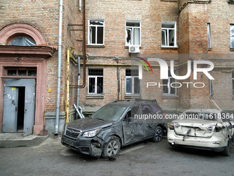 Cars damaged by falling wreckage of a downed Russian 'Shahed' drone in the Pechersk district of Kyiv, Ukraine, on September 26, 2024. NO USE...