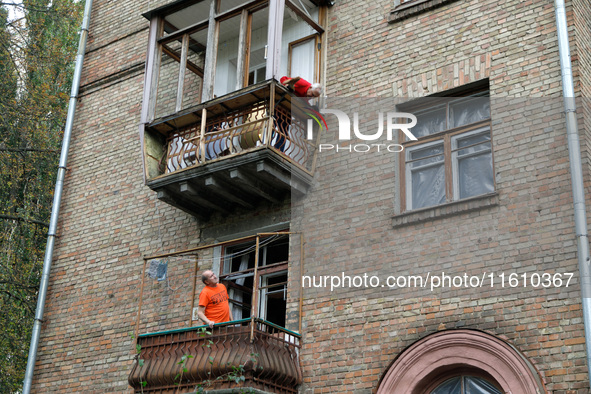 A residential building is damaged by falling wreckage of a downed Russian 'Shahed' drone in the Pechersk district of Kyiv, Ukraine, on Septe...