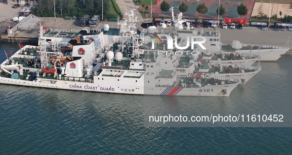 Coast guard ships are seen at a dock in Yantai, China, on September 26, 2024. 