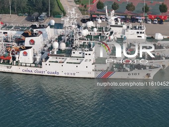 Coast guard ships are seen at a dock in Yantai, China, on September 26, 2024. (