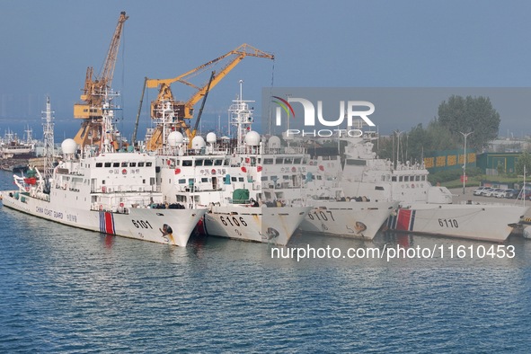 Coast guard ships are seen at a dock in Yantai, China, on September 26, 2024. 