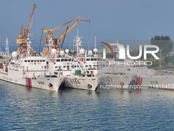 Coast guard ships are seen at a dock in Yantai, China, on September 26, 2024. (