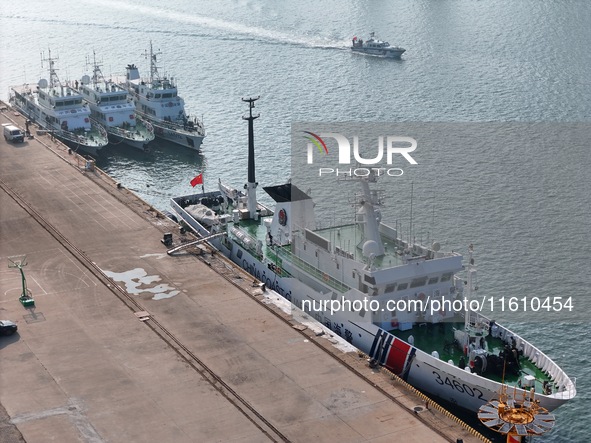 Coast guard ships are seen at a dock in Yantai, China, on September 26, 2024. 