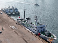 Coast guard ships are seen at a dock in Yantai, China, on September 26, 2024. (