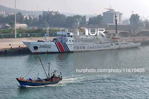 Coast guard ships are seen at a dock in Yantai, China, on September 26, 2024. 