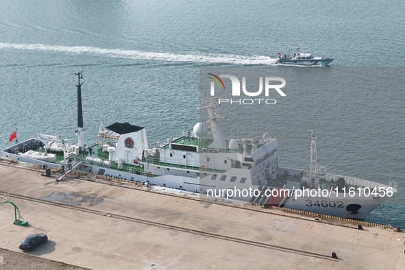 Coast guard ships are seen at a dock in Yantai, China, on September 26, 2024. 