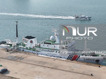 Coast guard ships are seen at a dock in Yantai, China, on September 26, 2024. (