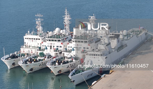 Coast guard ships are seen at a dock in Yantai, China, on September 26, 2024. 