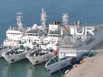 Coast guard ships are seen at a dock in Yantai, China, on September 26, 2024. (