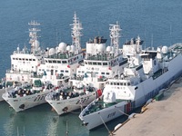 Coast guard ships are seen at a dock in Yantai, China, on September 26, 2024. (