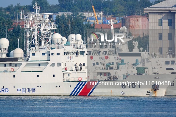 Coast guard ships are seen at a dock in Yantai, China, on September 26, 2024. 